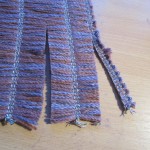 Cutting the chenille ready to weave with
